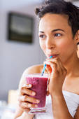 woman drinking smoothie